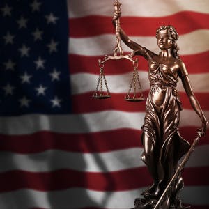 The American flag and the scales of justice