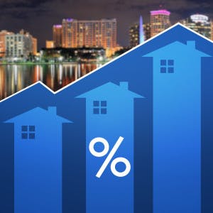 Data of houses going upwards with percentage sign with Orlando skyline in background