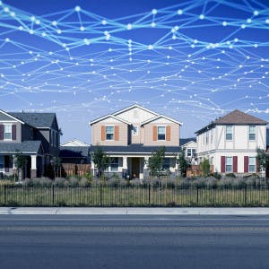A web of interconnected points makes up the sky above a house-lined street
