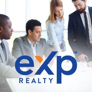 The eXp Realty logo against a backdrop of a group of business people sitting around a table. 