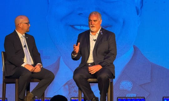 Clint Skutchan and NAR President Kevin Sears on stage at the T3 Leadership Summit in Scottsdale, AZ, on April 23.