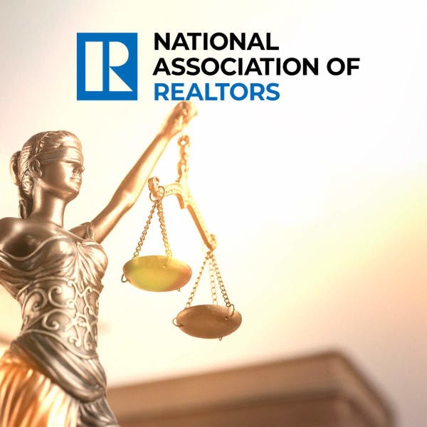 The National Association of Realtors logo against the backdrop of the scales of justice.