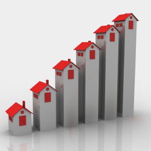 A bar graph made of increasingly taller houses to represent rising homeownership rates.
