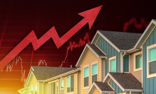 An upward arrow next to a house signifies rising interest rates an an overheated economy.