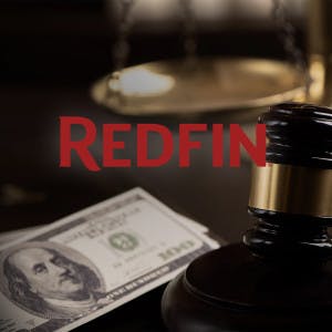 Redfin logo and a gavel and hundred dollar bills.