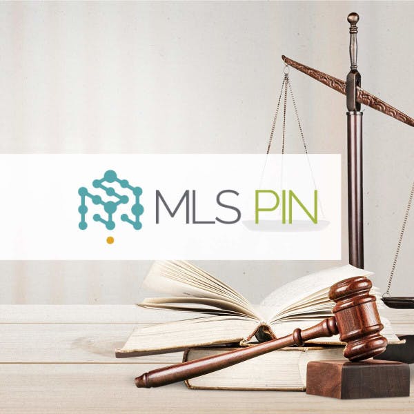 The MLS PIN logo against a backdrop of the scales of justice.