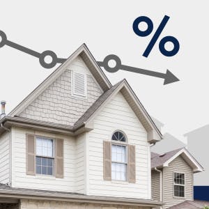 House with arrow going slightly down with percentage sign