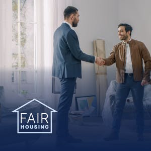 New homebuyers shake hands with their agent
