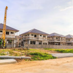 A row of homes under construction in a new development. 
