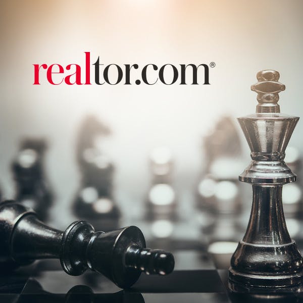 Realtor logo overlayed on top a background of chess
