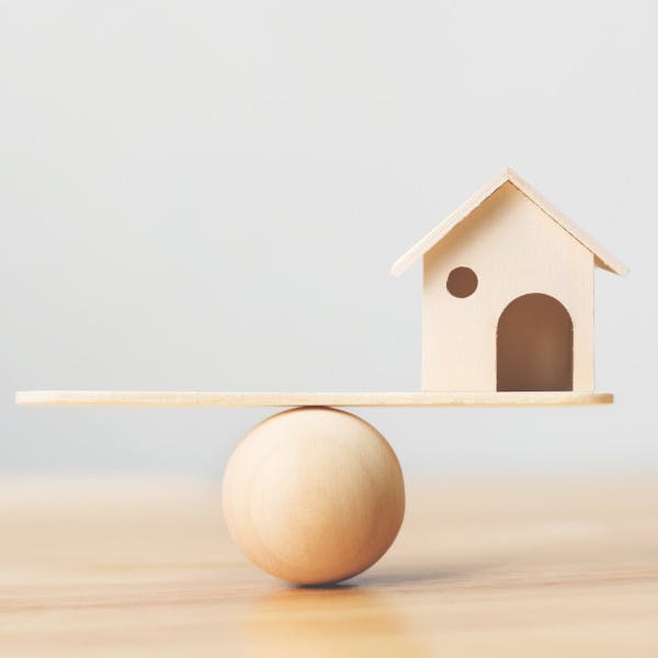 More balanced market: Model of house being balanced