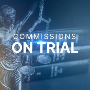 Commission on trial and a stack of law books