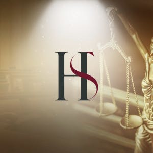 HomeServices of America logo and the scales of justice