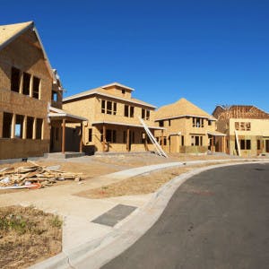 A row of new homes under construction.