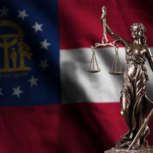 Georgia flag and scales of justice