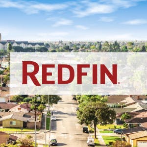 Redfin logo and an aerial view of houses in Orange County, CA