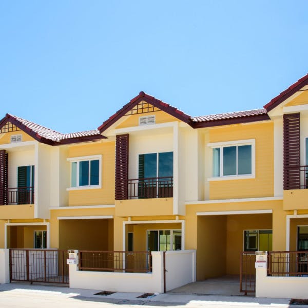 A row of newly built yellow houses