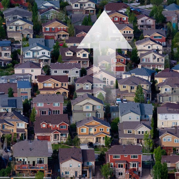 An aerial view of houses and an up arrow