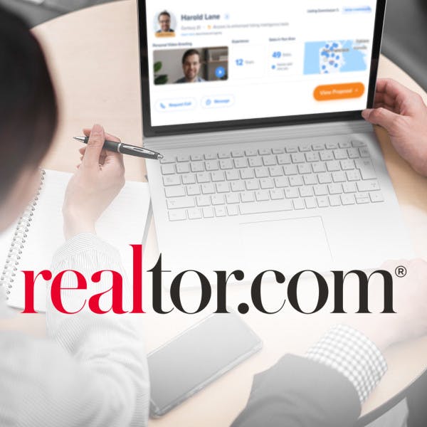 The realtor.com logo in front of a laptop displaying the company's Listing Toolkit product.