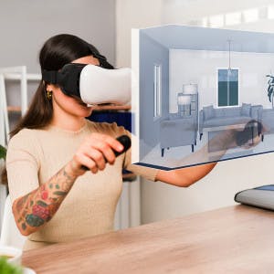 Woman viewing virtual reality image of home