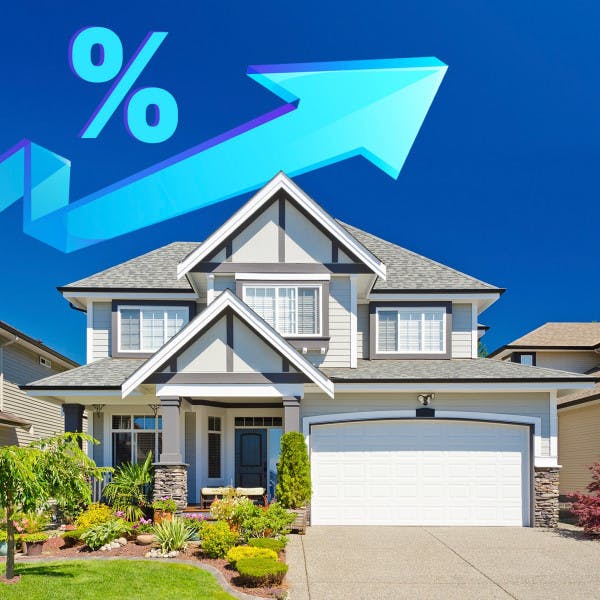 An upward-pointing arrow with an interest rate symbol above a house.