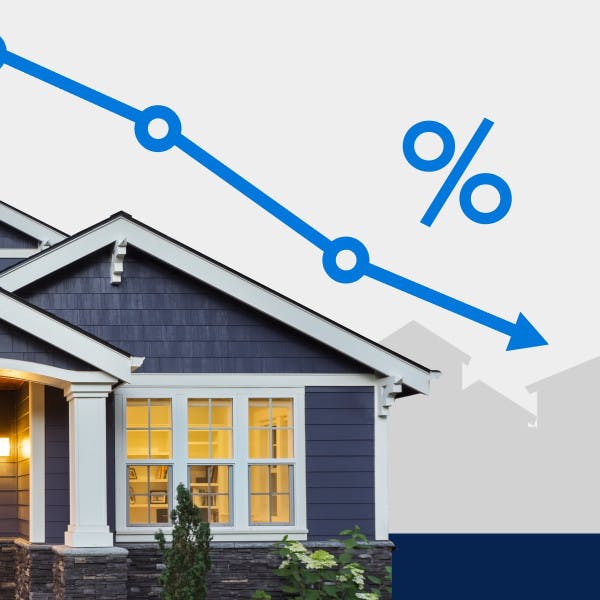 A house with a line representing declining mortgage rates.