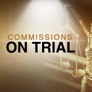 Commission on trial and the scales of justice.