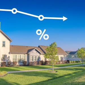 A large suburban home and a trend line with a percentage symbol