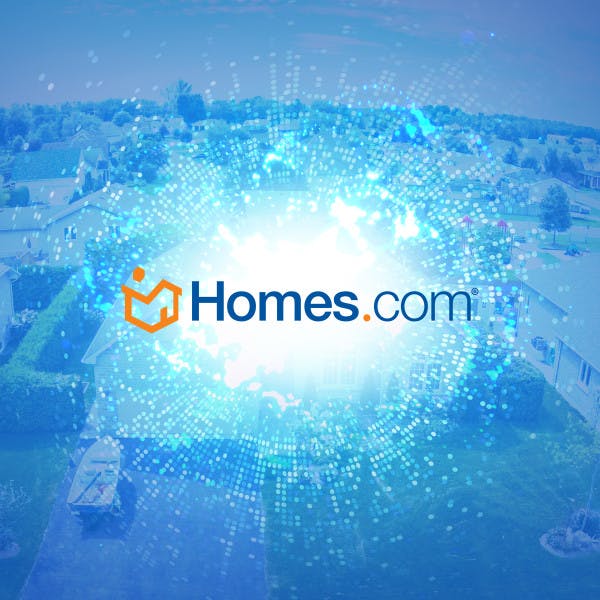 Homes.com logo and data overlayed on an aerial view of houses
