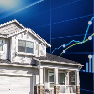 A house against a background of financial charts