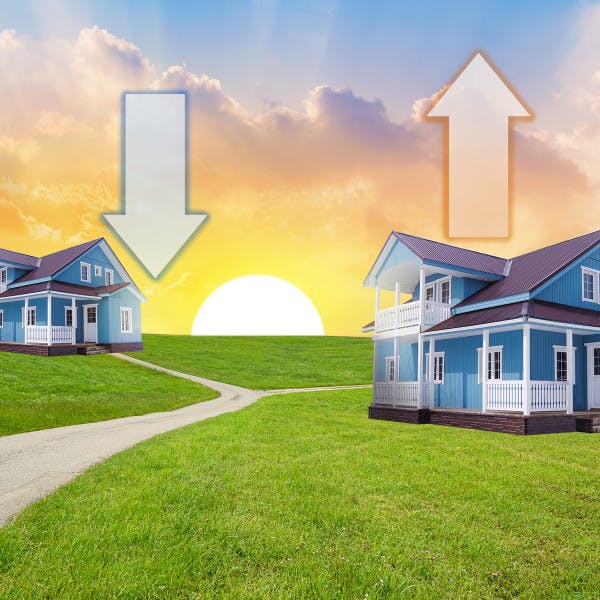 Two homes set against a rising sun with up and down arrows representing the direction the housing market could go.