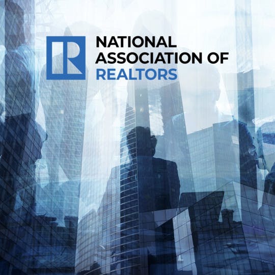 National Association of Realtors logo and an abstract background of businesspeople and buildings.